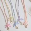 Original new spring and summer candy-colored striped bow, long crossbody shoulder strap, mobile phone lanyard, ID card and name tag neckband Application Scenario